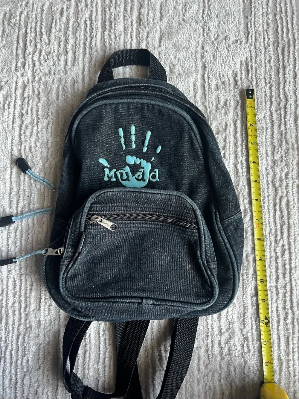 Mudd Black Backpack with Teal Handprint Accent